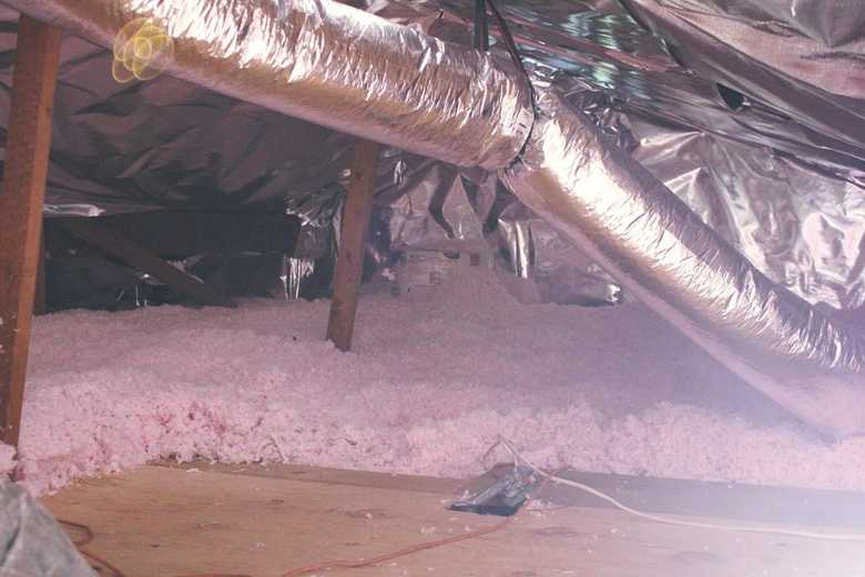 Ductwork above attic insulation